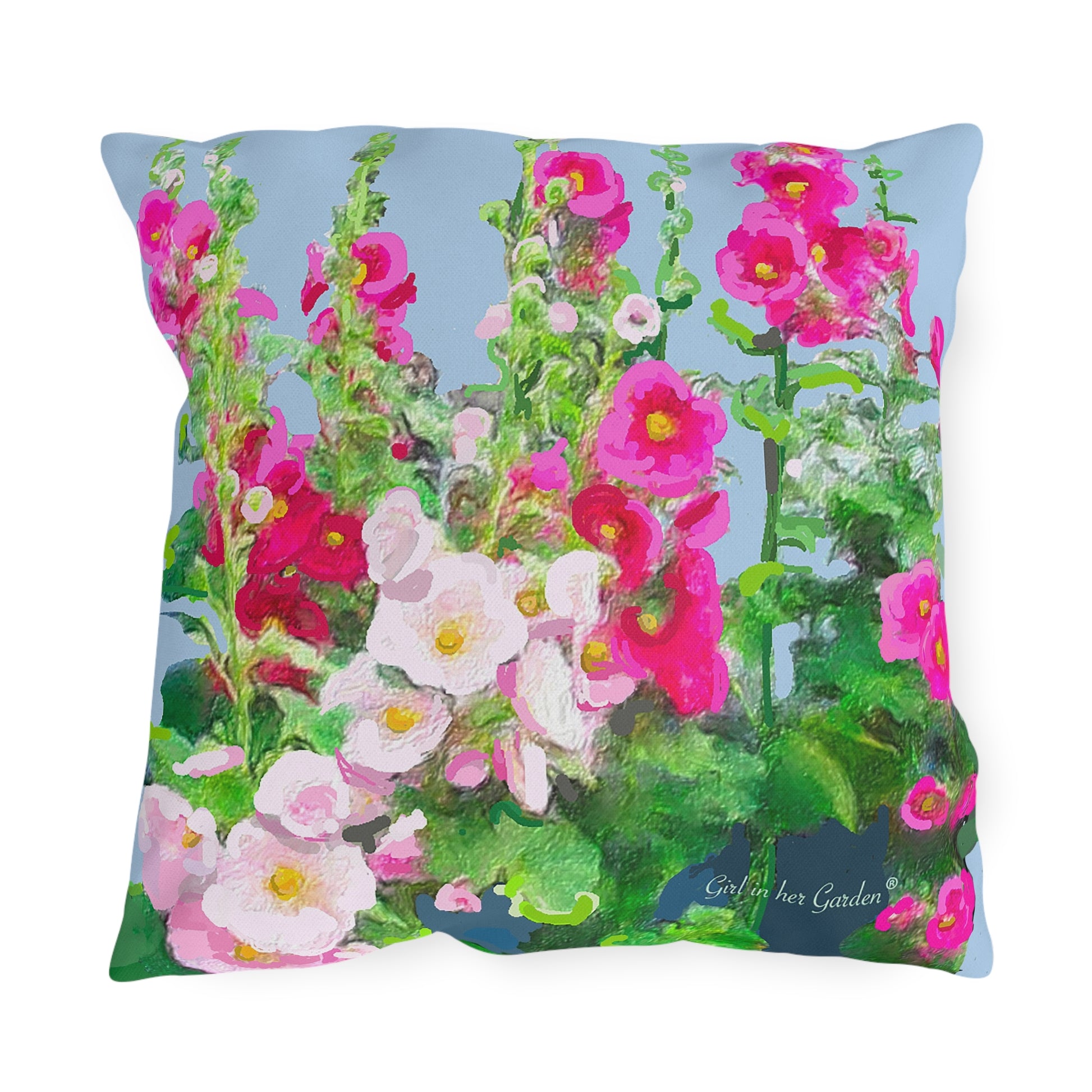 Outdoor decorative pillow with a floral design, featuring pink and green colors, showcasing hollyhocks.