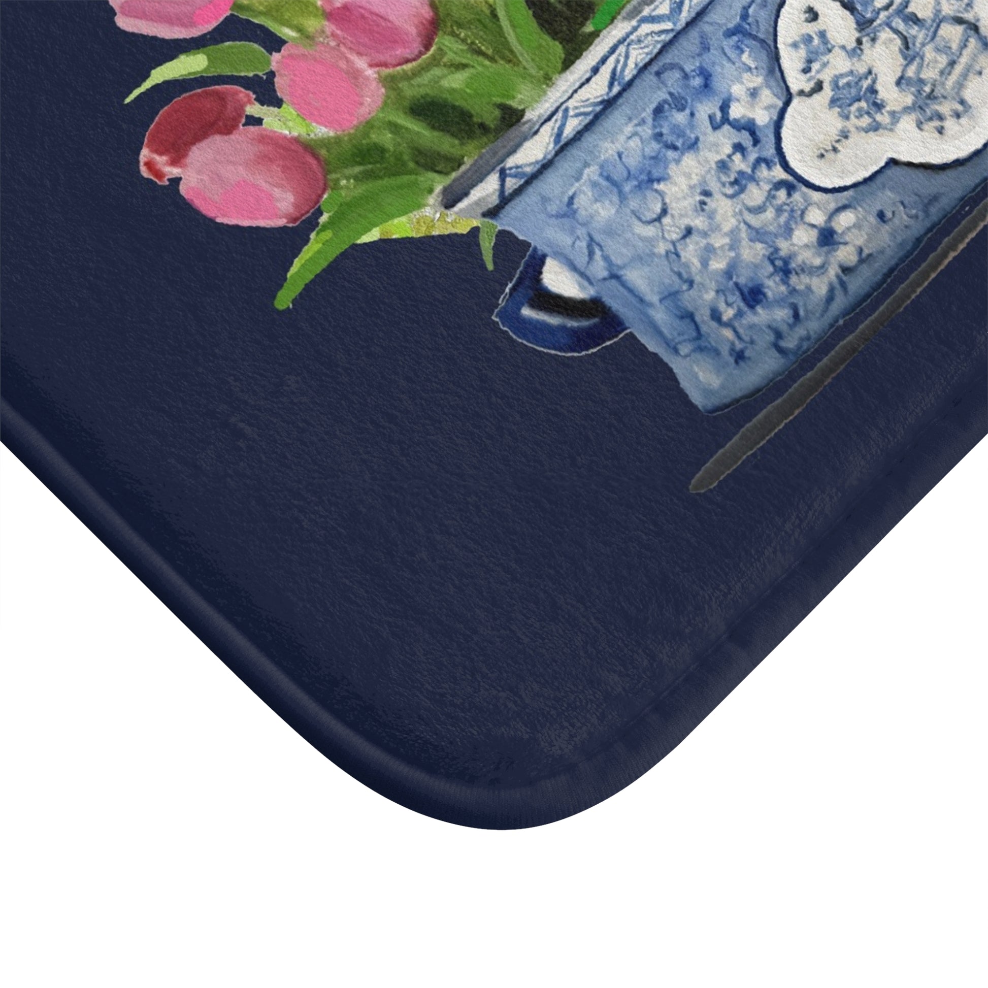 Navy blue phone case with floral design and blue and white patterned flap
