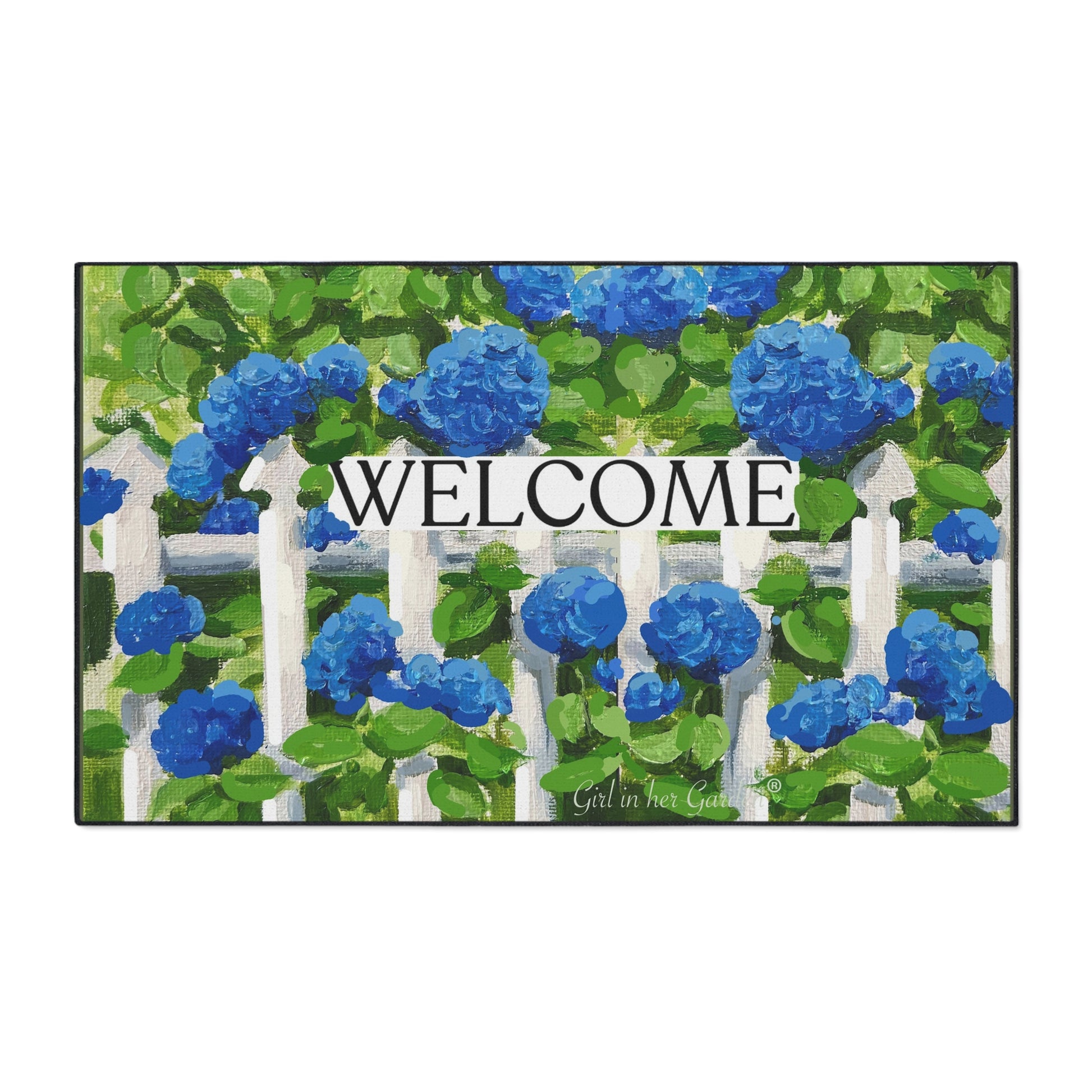 Doormat with blue flowers and a white picket fence design, featuring the word 'WELCOME'.