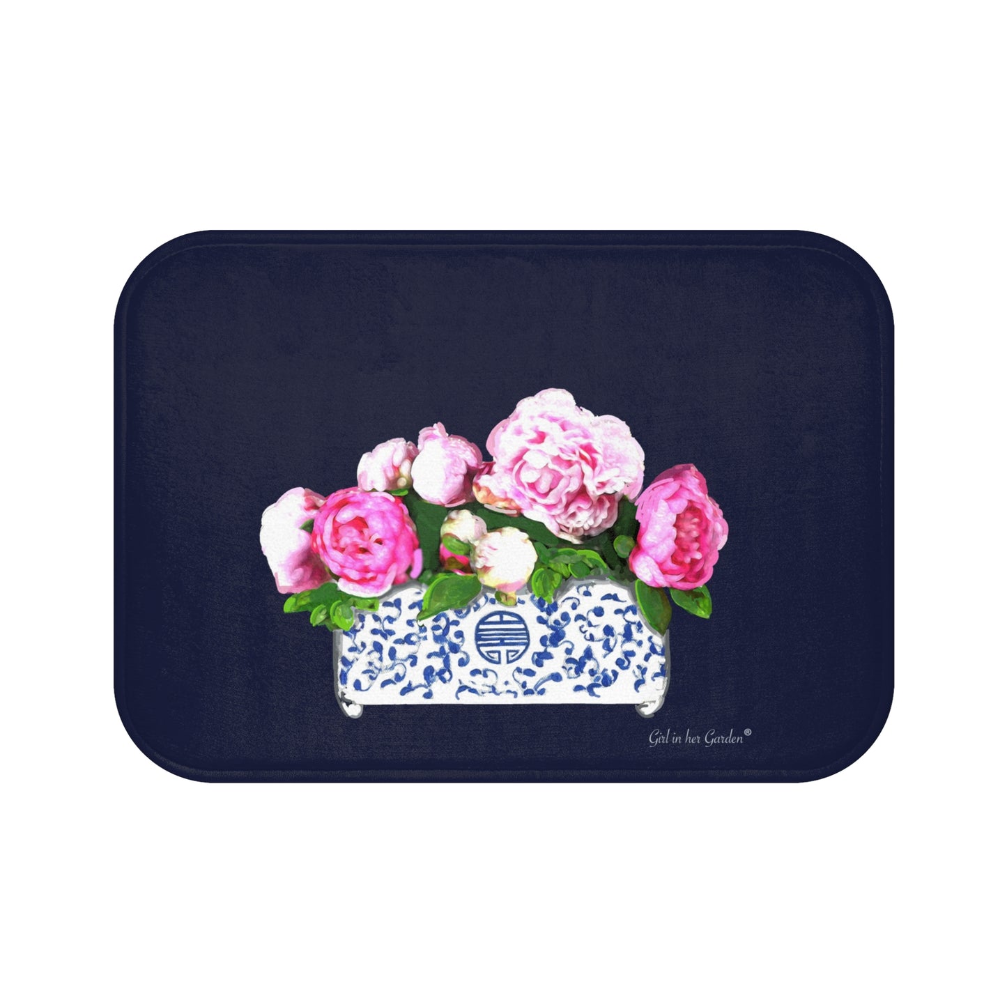 Navy bath mat with floral design featuring pink and white flowers on a white background