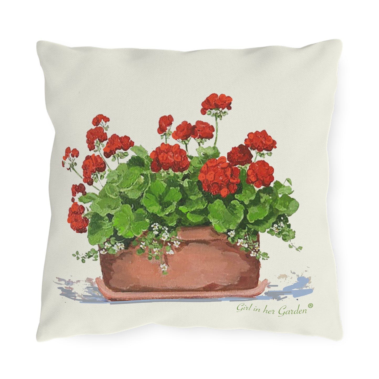 Outdoor pillow with red geranium floral design in a brown pot on a white background.