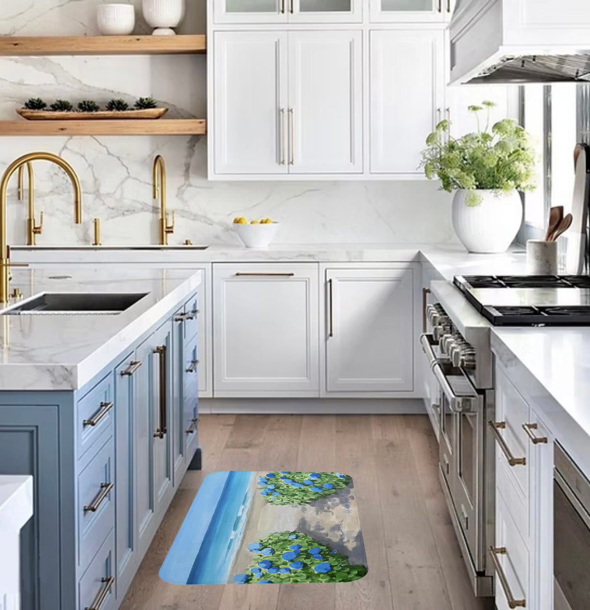 Modern kitchen with marble countertops and stainless steel appliances, featuring a decorative rug.