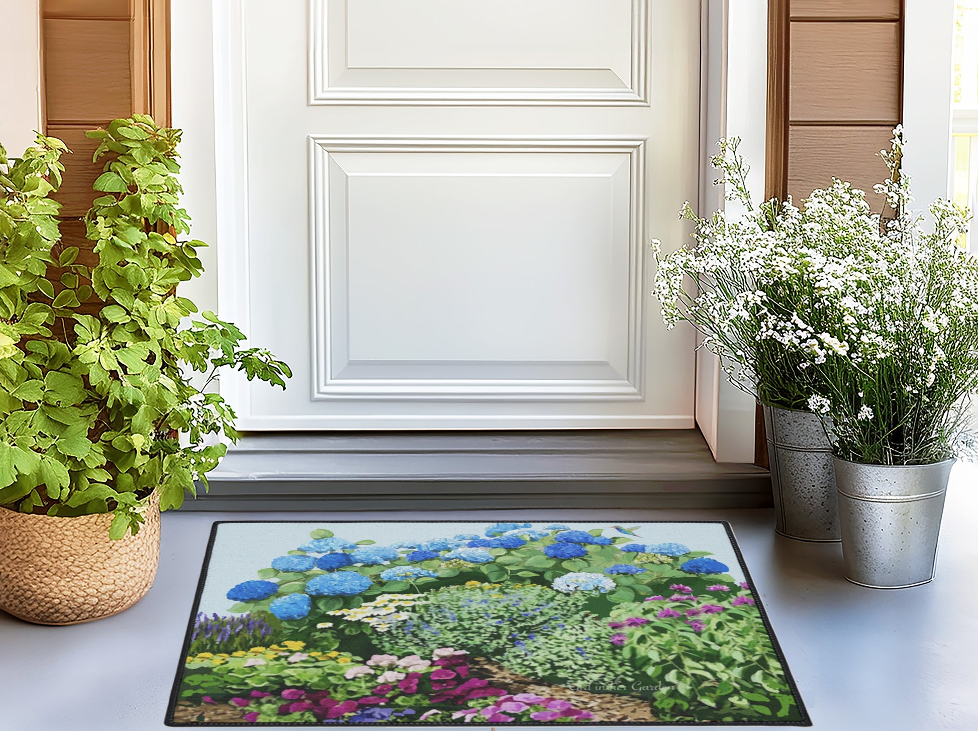 Decorative rug with garden design on a white floor, flanked by potted plants.