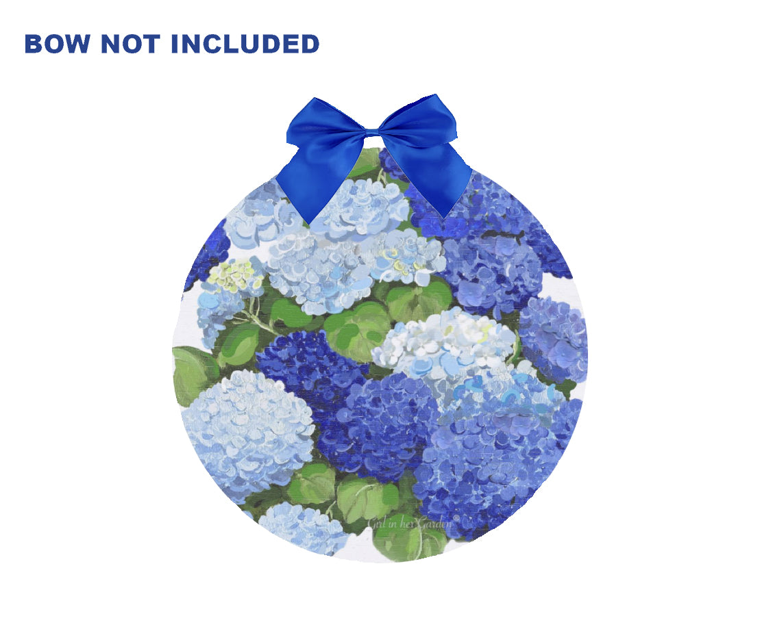 Round decorative item with blue hydrangea pattern and a blue bow on a white background.